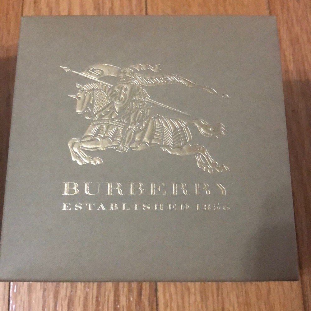 Gold Burberry watch dial.